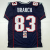 Autographed/Signed Deion Branch #83 New England Blue Football Jersey JSA COA
