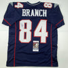 Autographed/Signed Deion Branch #84 New England Blue Football Jersey JSA COA