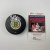 Autographed/Signed Patrice Bergeron Boston Bruins Logo Hockey Puck JSA COA
