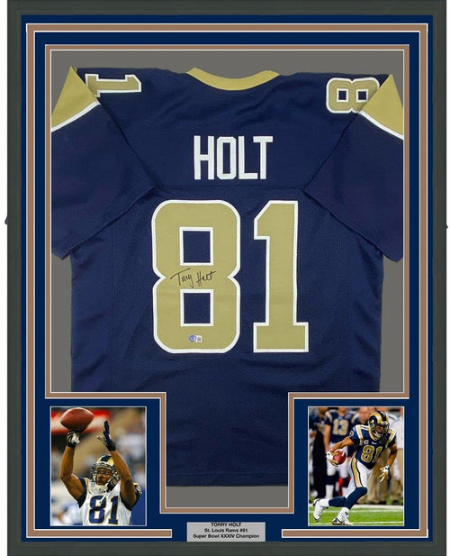 Framed Autographed/Signed Torry Holt 35x39 St. Louis Dark Blue Football Jersey Beckett BAS COA