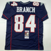 Autographed/Signed Deion Branch #84 New England Blue Football Jersey JSA COA
