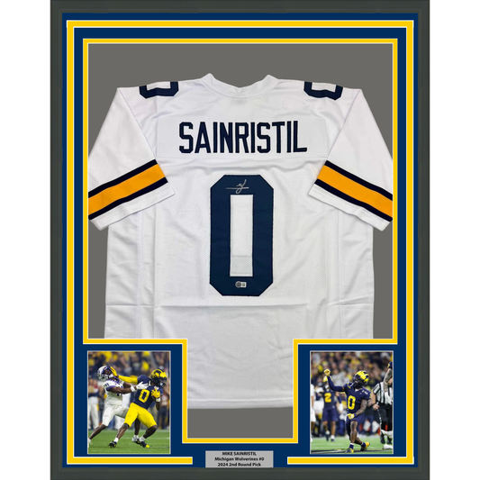 Framed Autographed/Signed Mike Sainristil 35x39 Michigan White College Football Jersey Beckett BAS COA