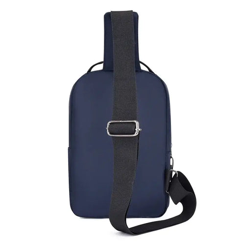 Navy blue crossbody bag with a simple design and adjustable strap, perfect for casual urban travel.